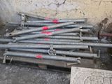 a pile of metal pipes sitting on the ground