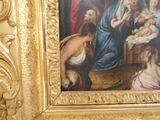 a painting of a woman holding a baby in a gold frame