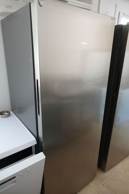 a refrigerator and a dishwasher in a kitchen
