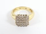 a close up of a diamond ring on a white surface