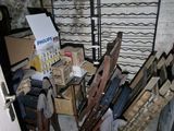 a room with a bunch of skis and boxes in it