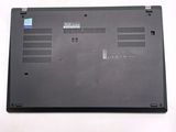 a laptop that is sitting on a white surface