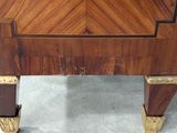 a wooden table with a wooden top and gold legs