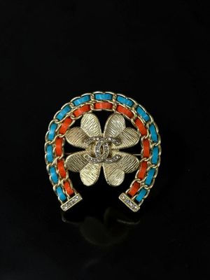 an image of a gold and turquoise broochle ring