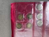a red case with coins inside of it on a table
