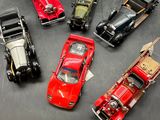several toy cars are lined up in a row on a table