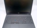the dell laptop is open and ready to be used
