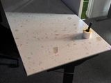 a desk with a chair and a lamp in a room