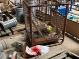 a cage with a bird inside of it on a pallet