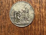 a coin that is sitting on a wooden table