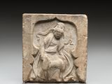 an image of a stone relief of a woman riding a horse
