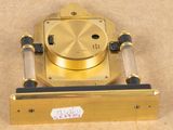 a gold clock that is sitting on a table