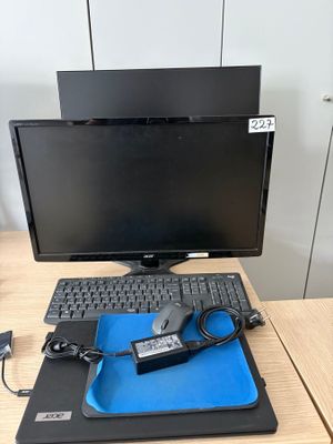 a computer on a desk with a mouse and keyboard