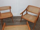 two chairs and a table with a glass top