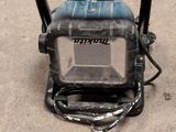 an image of a small portable power washer on the ground