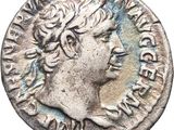 a silver coin with a woman ' s head on it