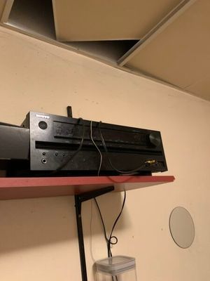 a picture of a shelf with a television on top of it