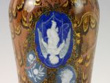 a vase that has a picture of a woman on it