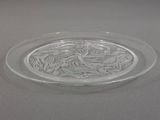 a glass plate with a design on it sitting on a table