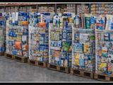 many boxes of food on a pallet in a store