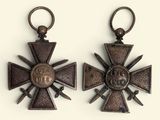 pair of bronze crosses with swords and cross heads on them
