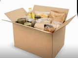 a cardboard box filled with food and condiments