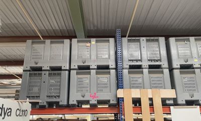 a lot of boxes that are stacked up in a warehouse
