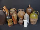 many different types of vases on a black background