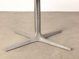 an image of a round table with a metal base