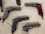 five different types of drill guns sitting on a table