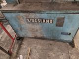 a blue machine that is sitting on the ground