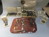 a table with silverware and other silverware on it