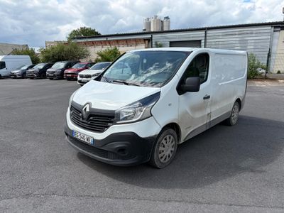 the white van is parked in the parking lot near other cars