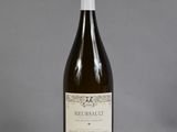 a bottle of wine that is sitting on a table