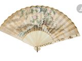an image of a fan with a painting on it on a white background