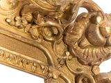 a gold frame with a picture of a bird on it