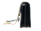 the small black purse has a gold chain around it