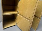 a wooden cabinet that has two shelves inside of it