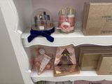 a shelf with a lot of beauty products on it