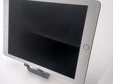 a tablet computer sitting on top of a table