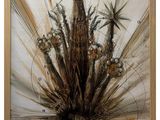 painting of a plant in a wooden frame on a white wall