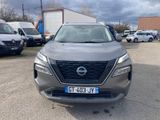 the front view of a silver nissan suv parked in a parking lot