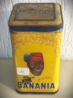une vieille boîte en fer-blanc sur laquelle figure l'image d'une femme portant un turban