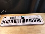 a keyboard that is sitting on a table
