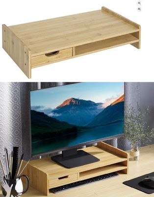 un bureau en bois sur lequel sont posés un écran d'ordinateur et un clavier