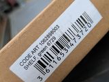 a brown box with a barcode on it sitting on a table