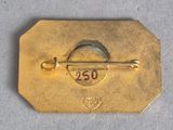 a gold tag with the number 25 on it