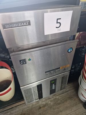 a picture of a coffee maker and a cup of coffee