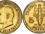 une pièce d'or sur laquelle figure l'image d'un homme