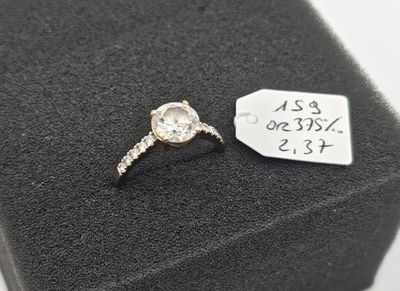 a close up of a diamond ring with a price tag on it